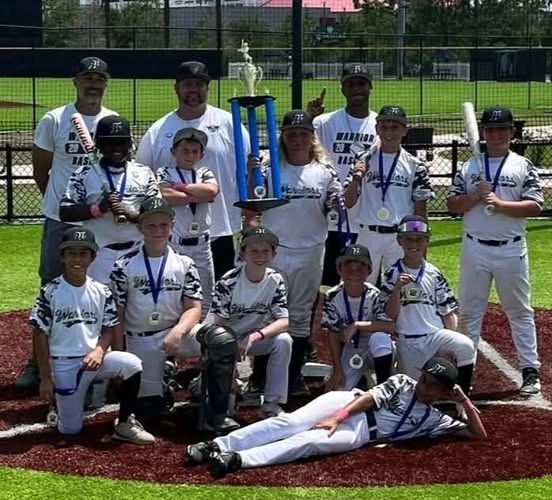 St. Augustine Warriors 12U baseball team with championship trophy